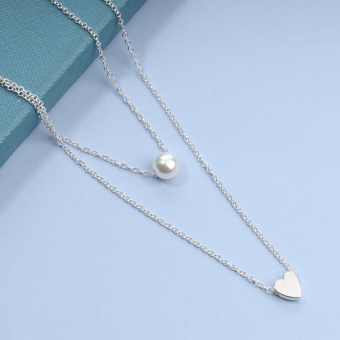 Yheakne Boho Layered Pearl Heart Necklace Silver Love Heart Pendant Necklace Elegant Pearl Necklace Chain Jewelry for Women and Girls