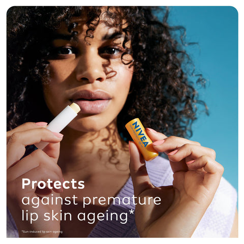 NIVEA SUN Protect Caring Lip Balm SPF50 (5.5ml), Factor 50 Lip Balm with Shea Butter, Protection Against UVA/UVB Rays with 24H Moisture, Lip Care, No White Cast